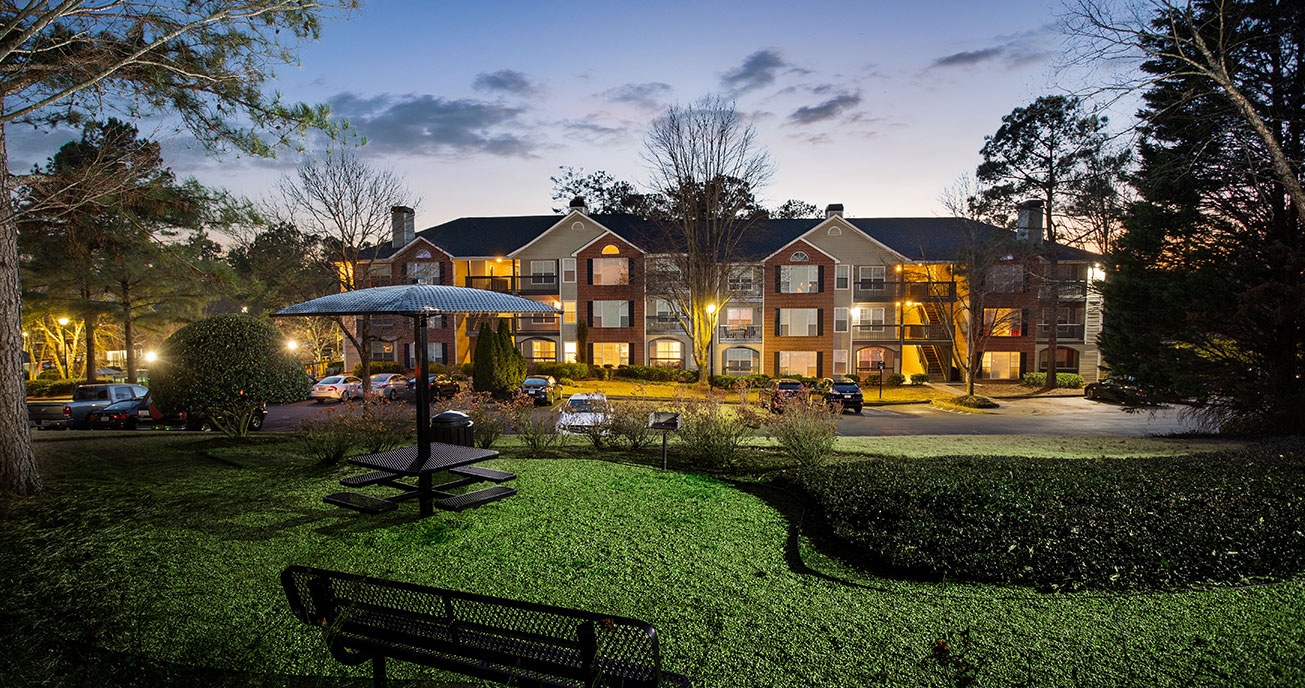 exterior of apartment complex with bench, river vista, atlanta ga